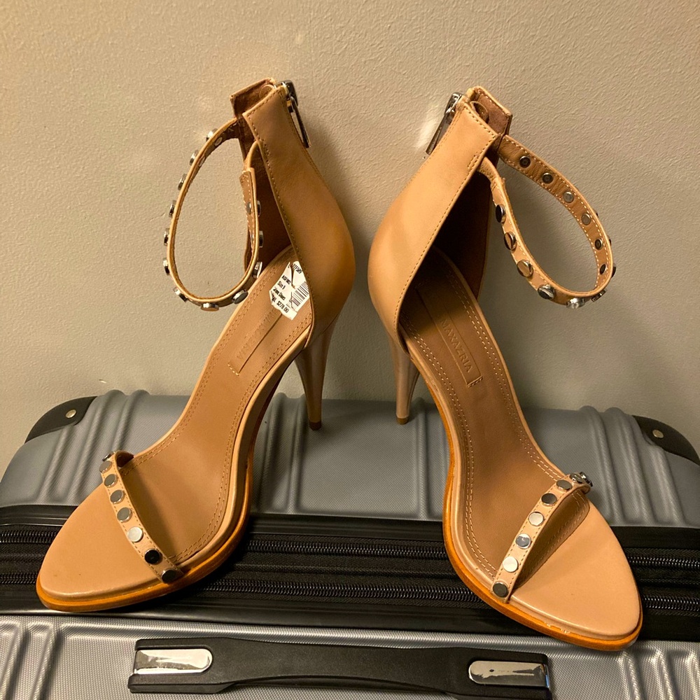 Tan strap open toe BCBG pumps.